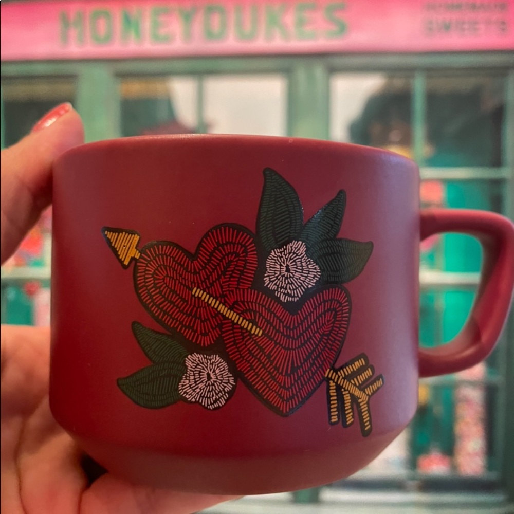Read Starbucks mug with two hearts